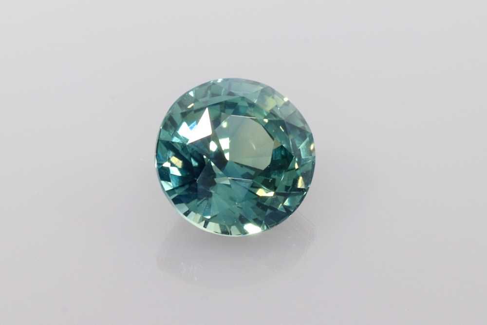 1.54ct Round Natural Sapphire (Colour Multicolor, Clarity Slightly Included, Cut Faceted)