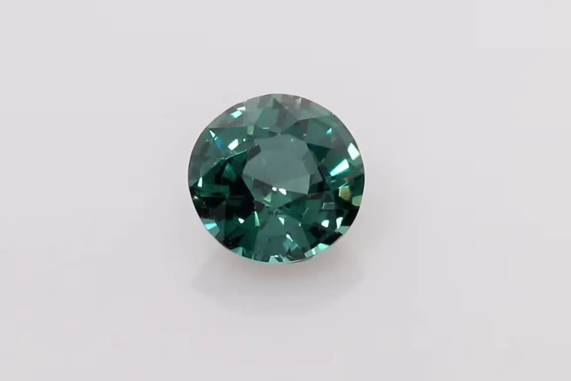 1.54ct Round Natural Sapphire (Colour Multicolor, Clarity Slightly Included, Cut Faceted)