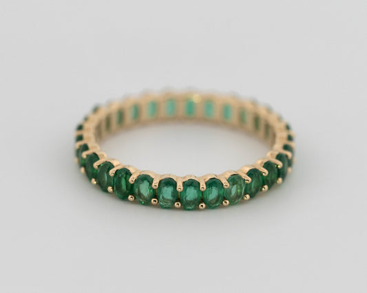 1.25ctw Oval Shaped Emerald Lab Grown Eternity Band